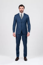 Man wearing a blue suit with a white shirt and tie on a white background