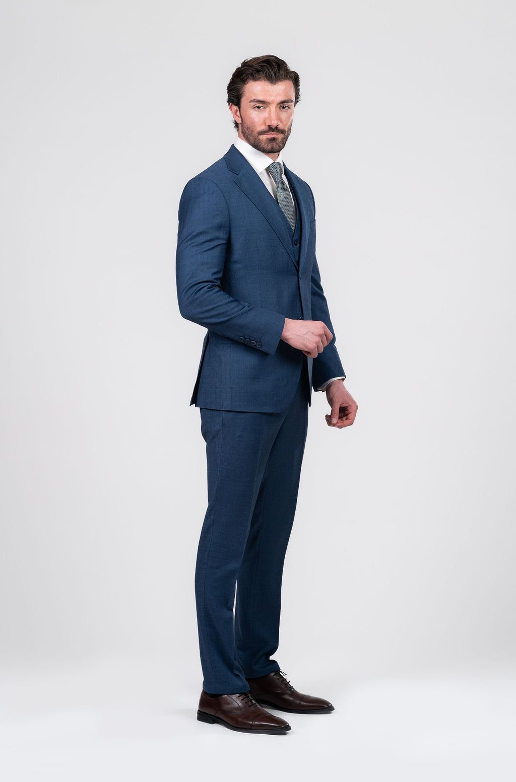 Man wearing a blue suit with a white background